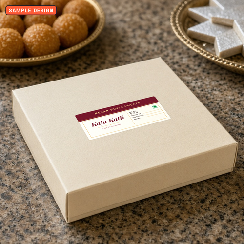 Custom sweet box label, 100 x 50 mm everyday premium kaju katli label for Kesar Kona Sweets on a cream sweet box lid, sample design for a made-up sweet shop