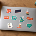 Laptop Sticker Pack: all ten StickerCon designs, including LGTM, ship it, 404 sleep not found and Pip the snake, on a silver laptop lid.