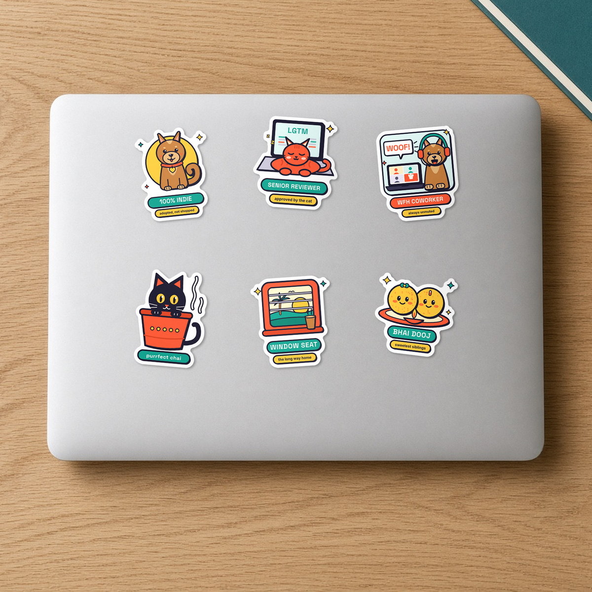 Pet Parents Sticker Pack: six vinyl stickers on a laptop lid including 100% Indie dog, WFH Coworker, Senior Reviewer, Kulhad Cat, Laddoo Siblings and Window Seat